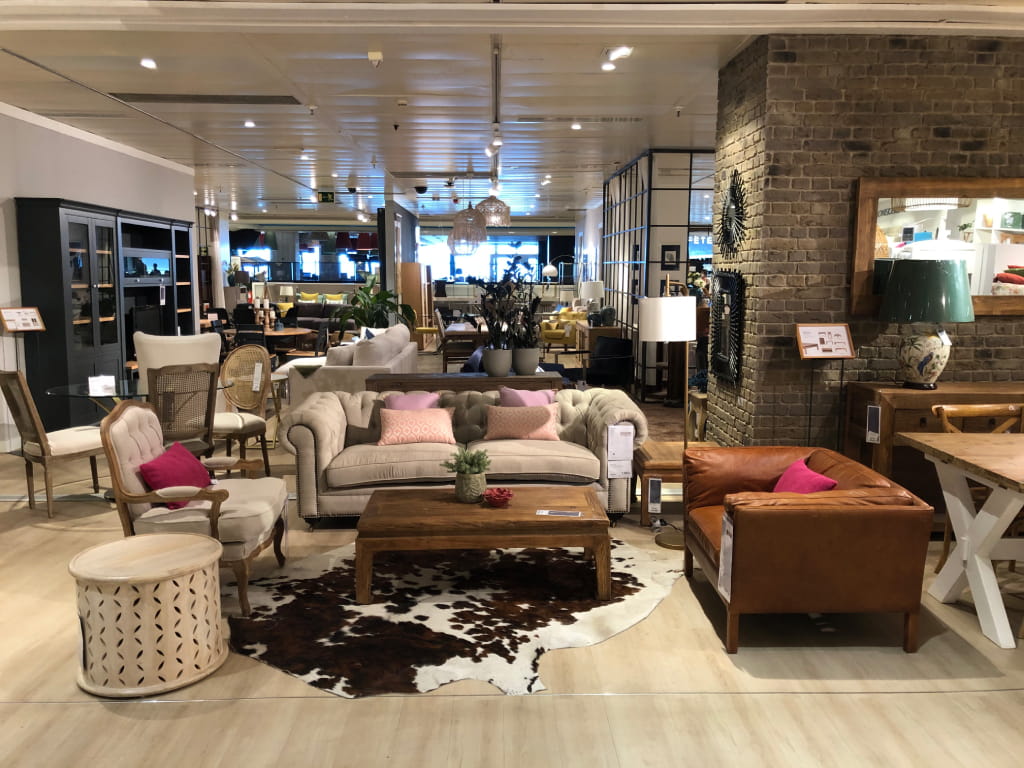 Living room furniture in a showroom in Tenerife with sofa and armchairs.