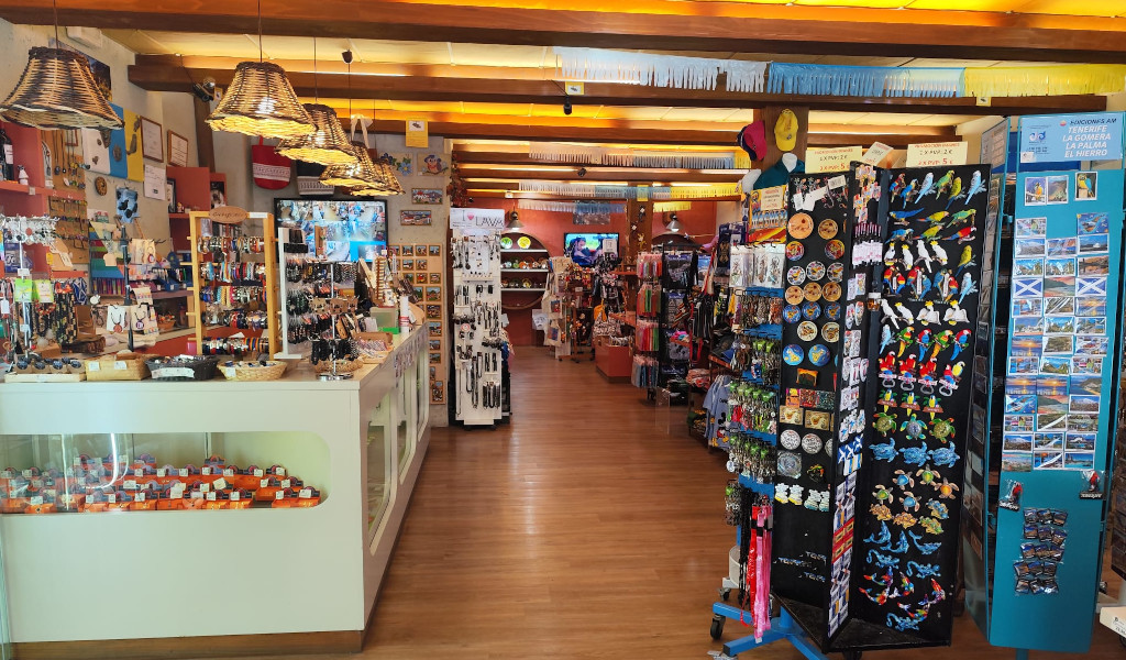 Souvenir shop in Tenerife with magnets and postcards on display.
