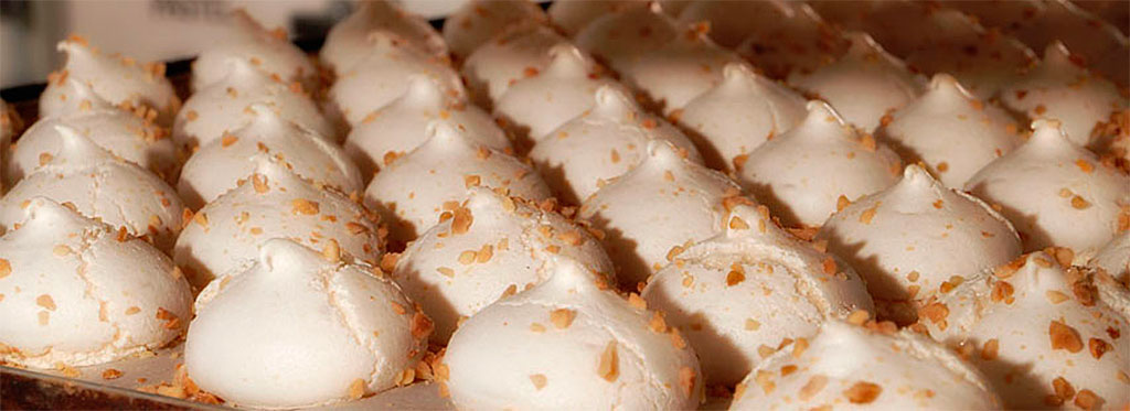 Meringues with almonds on a tray in a pastry shop in Tenerife.