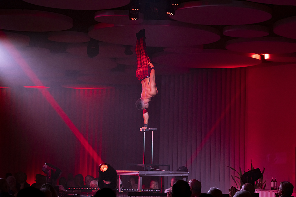 Artist balancing inverted on one hand during a show in Tenerife.