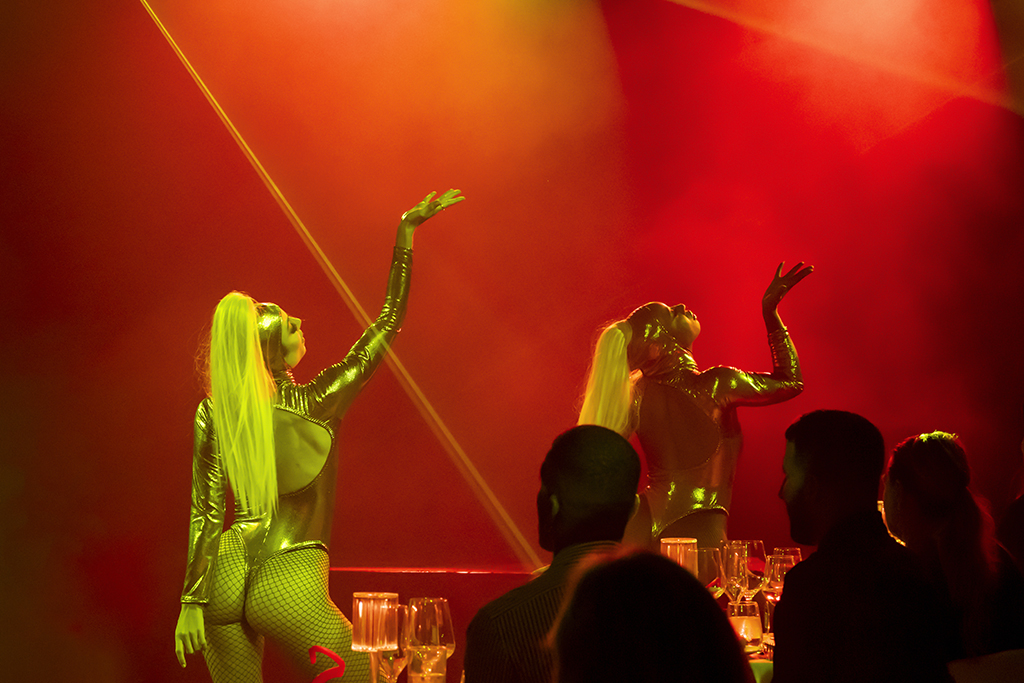 Artists in golden suits performing on an illuminated stage in Tenerife.