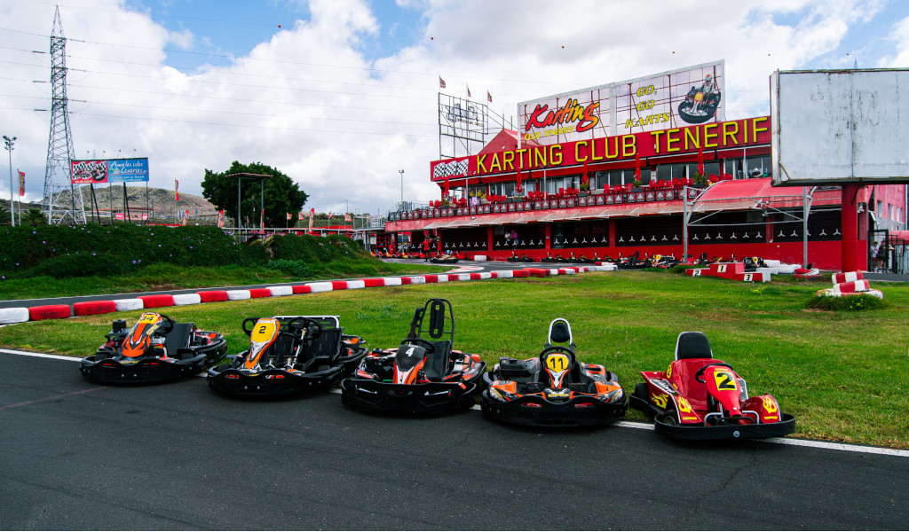 Karts lined up in front of the Karting Club Tenerife with a GO GO sign.