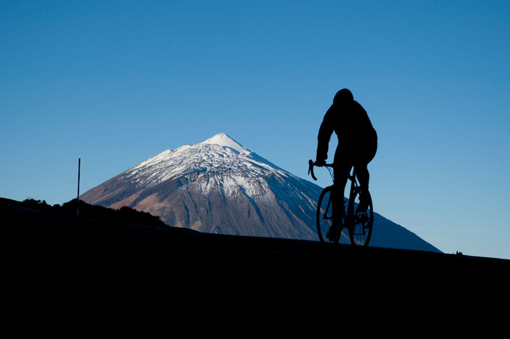 Cyclist in front of the Teide volcano in Tenerife.
