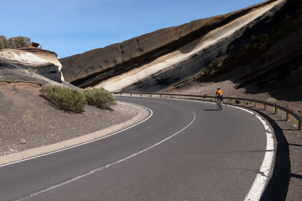 Cyclist riding the road in the Teide National Park, Tenerife.