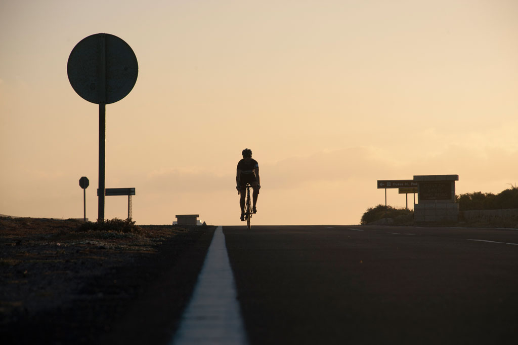 Road cyclist at sunset in Tenerife.