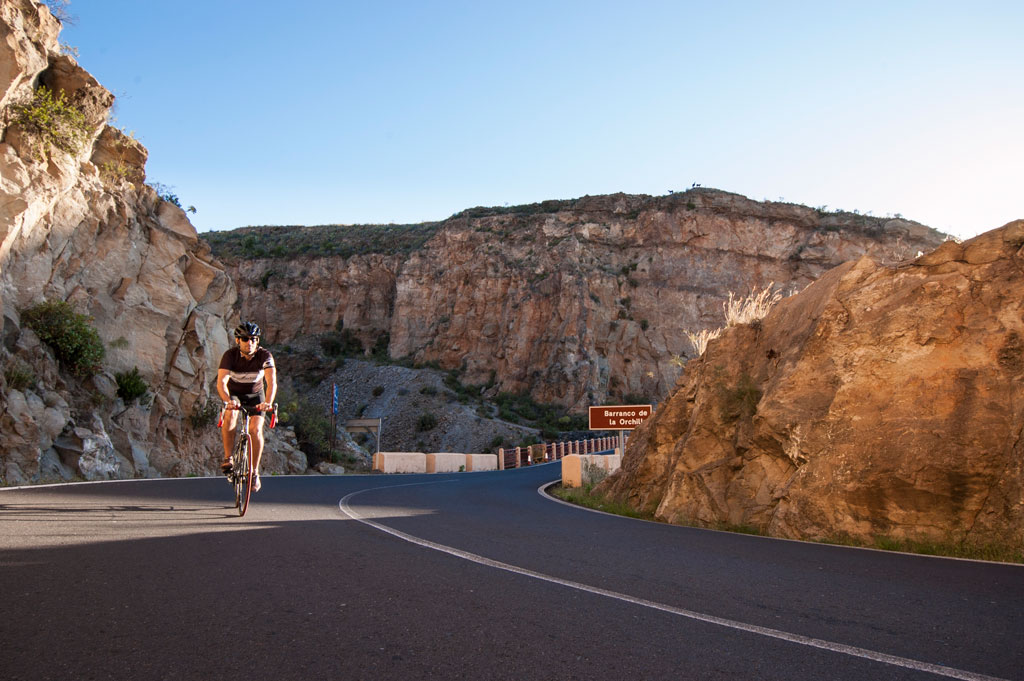 Road cyclist in the Barranco de la Orchilla, Tenerife.