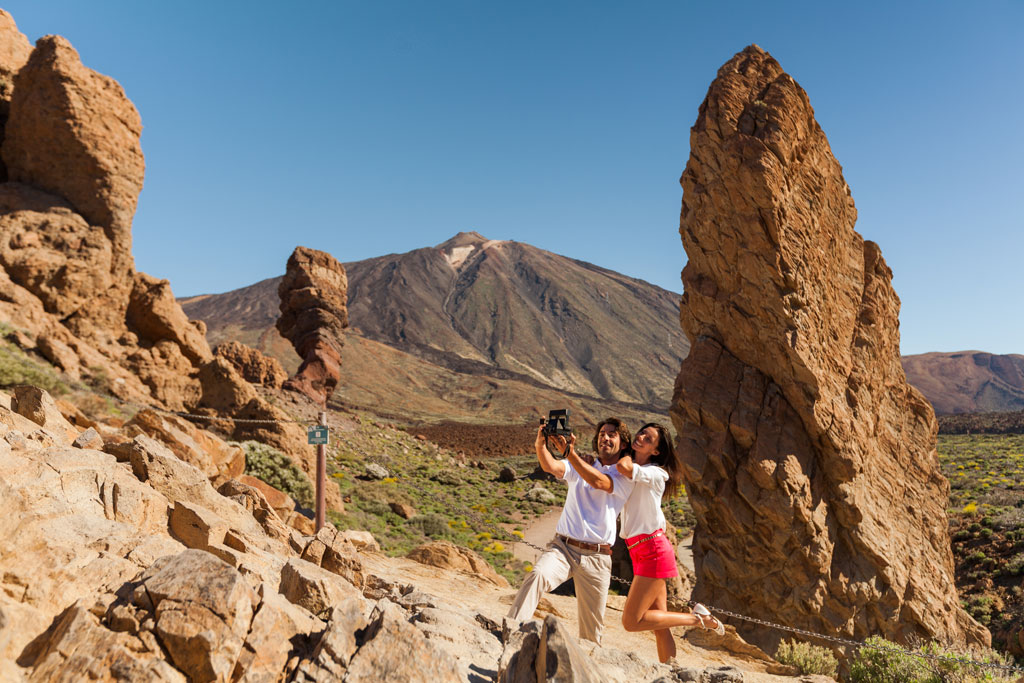 Couple taking a selfie in Teide National Park, Tenerife.