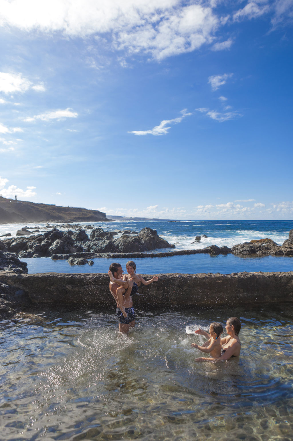 Family enjoying the natural pools of Bajamar, Tenerife.