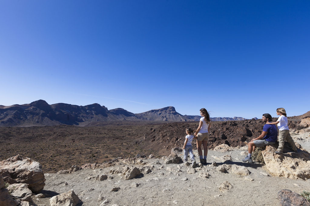 Family enjoying the scenery in Teide National Park, Tenerife.