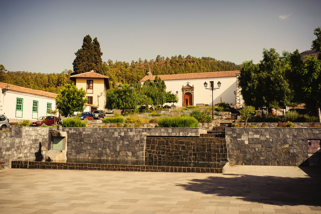 Square with trees and historic buildings in Vilaflor, Tenerife.
