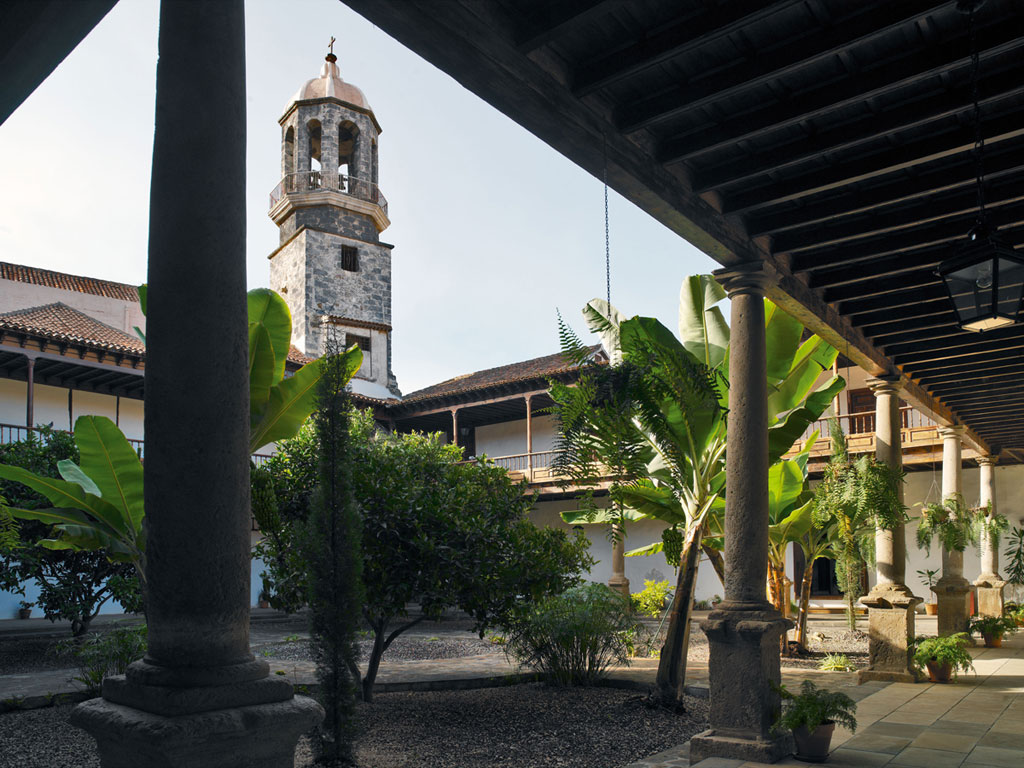 Interior courtyard with plants and tower in La Laguna, Tenerife.