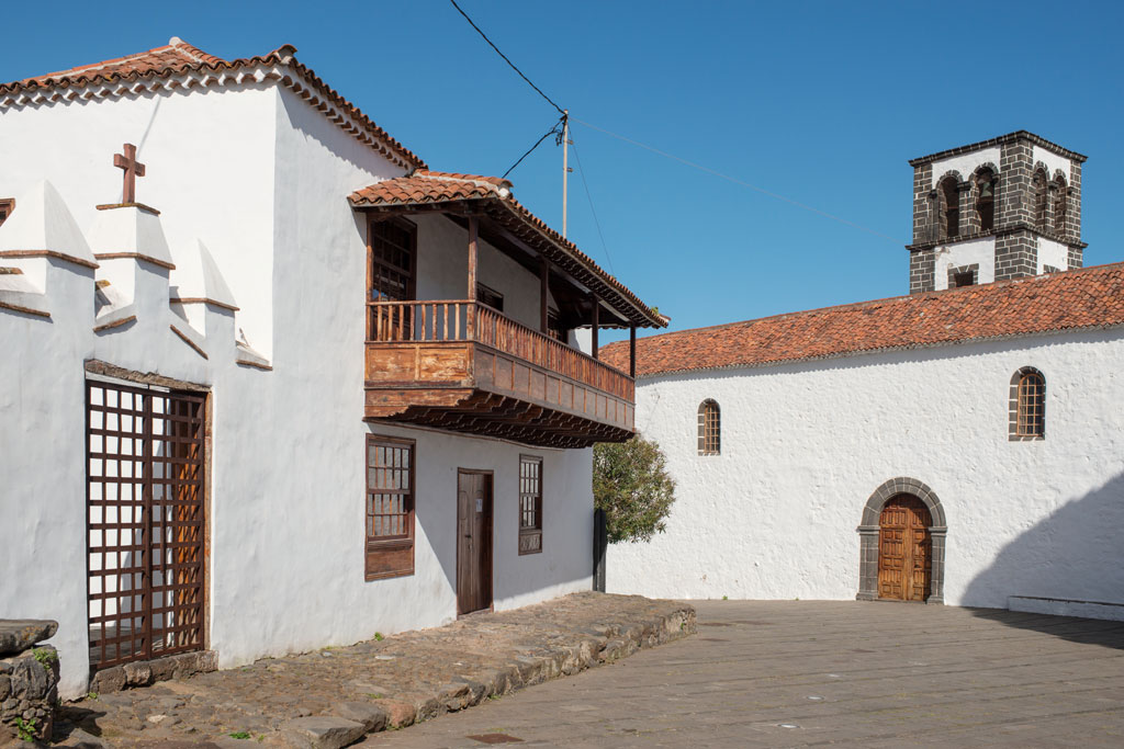Traditional architecture and church tower in La Laguna, Tenerife, clear sky.