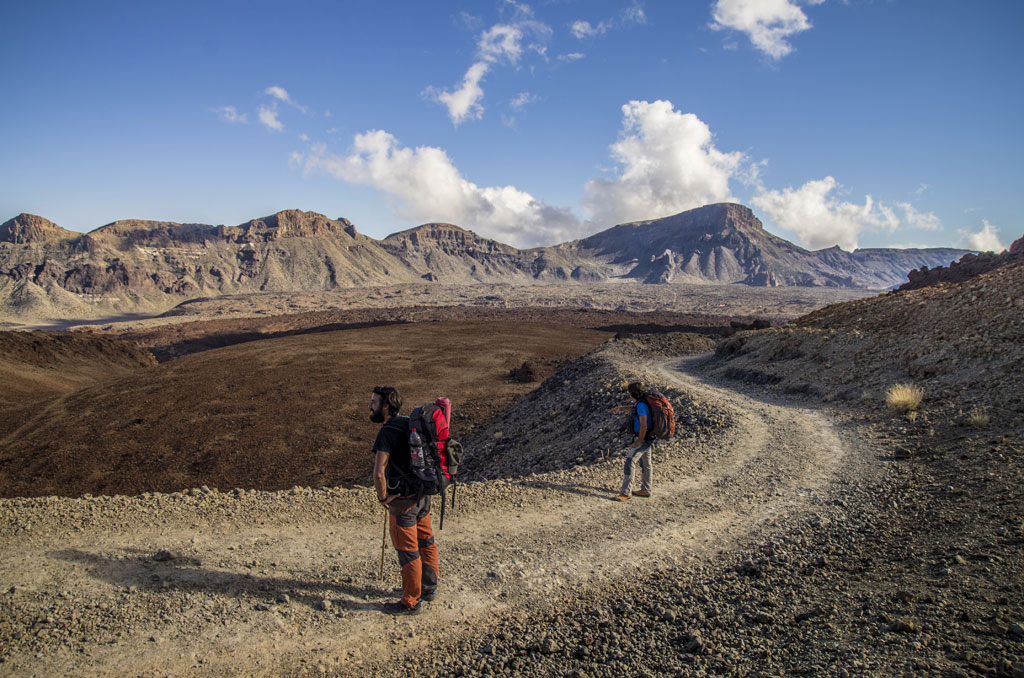 Trail with two hikers in the Teide National Park, Tenerife.