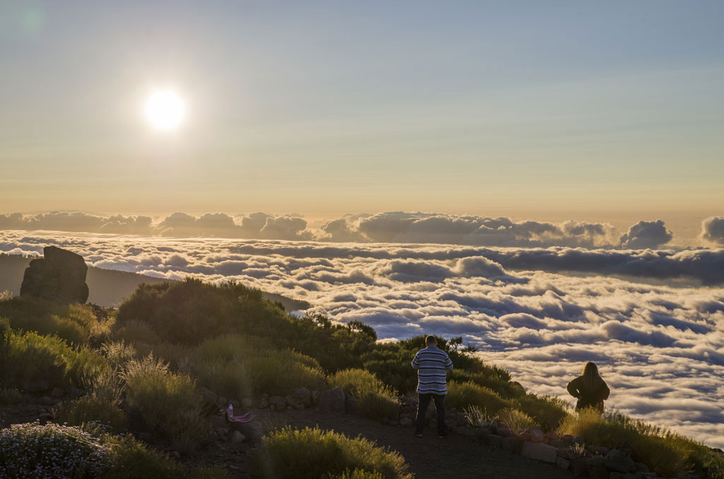 People watching a sunset over the clouds in the Teide National Park, Tenerife.