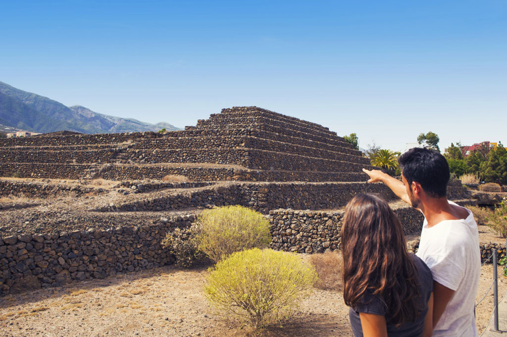 Couple looking at the stone pyramids in Güímar, Tenerife.