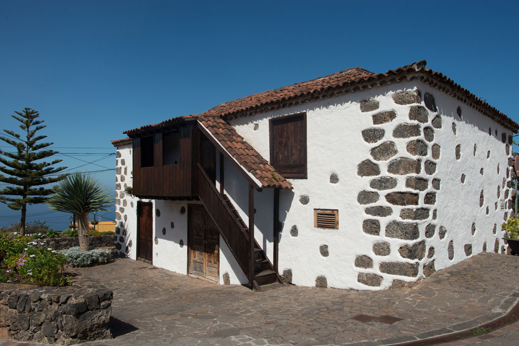Traditional stone and wooden house in La Orotava, Tenerife, with exterior stairs.
