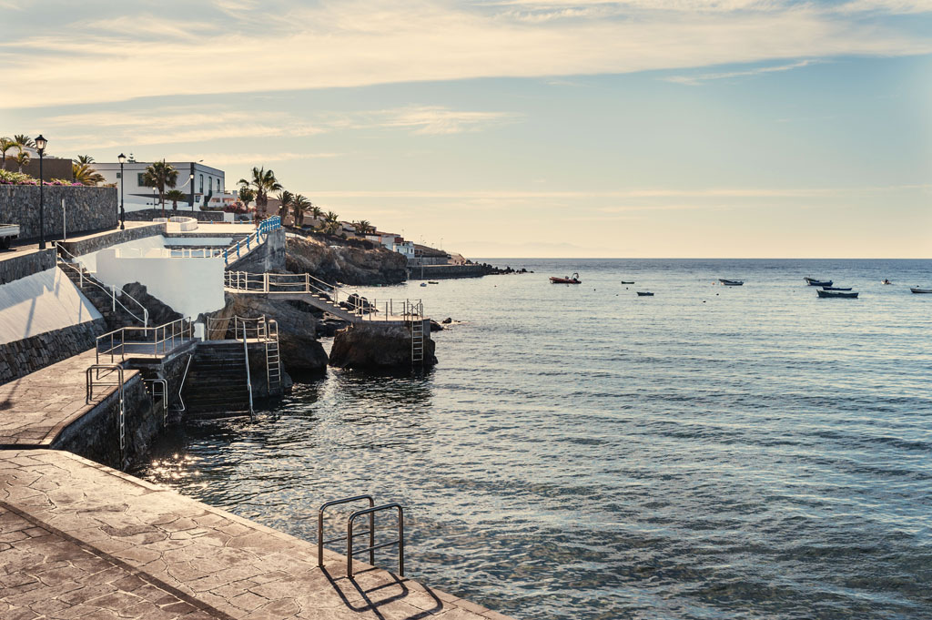 Promenade with railings and stairs in Puerto de Santiago, Tenerife.