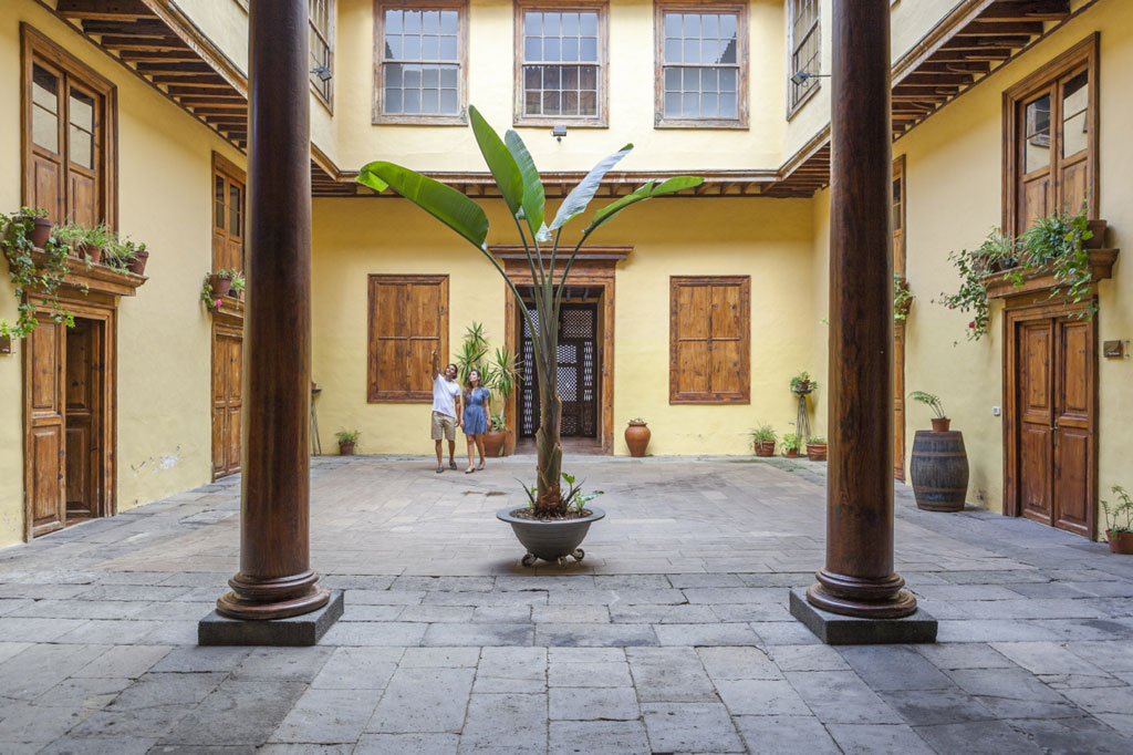 Interior courtyard with two people in a typical house in La Laguna, Tenerife.