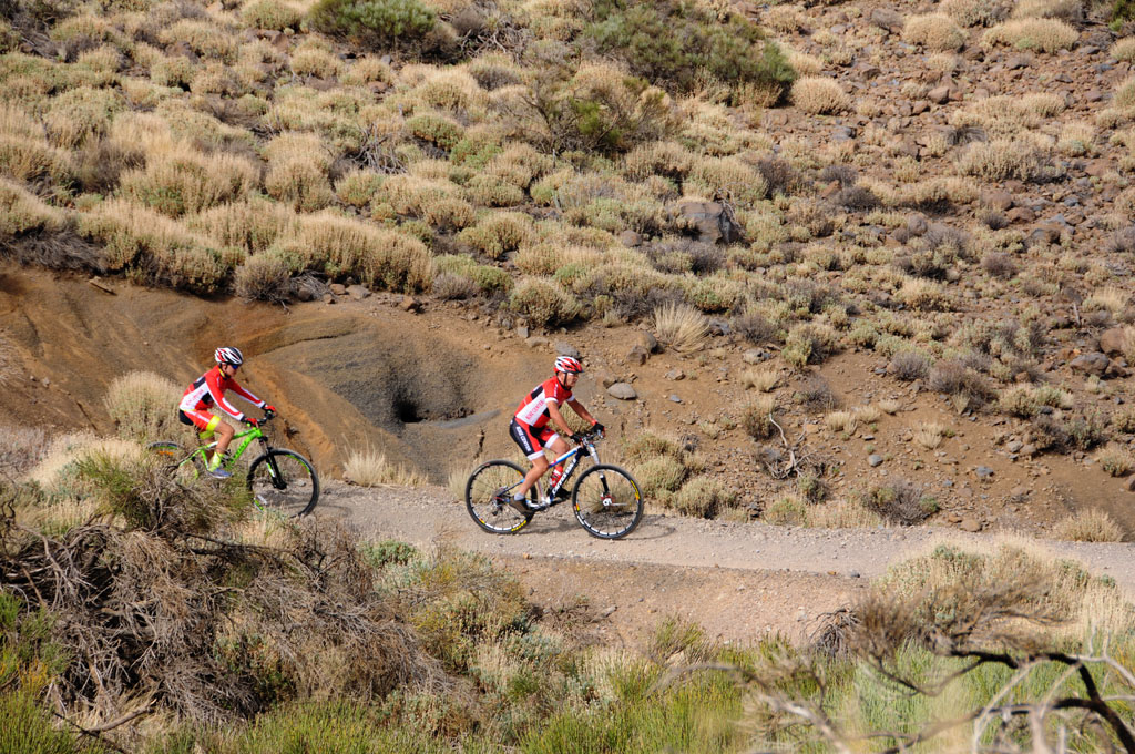 Cyclists on a dirt road in the Teide National Park, Tenerife.