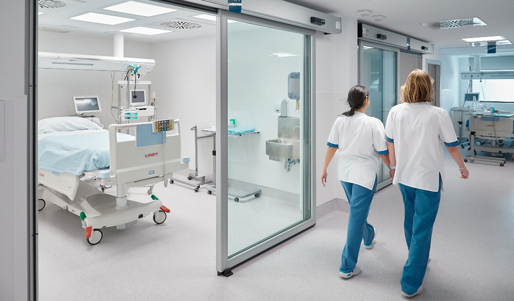 Medical staff walking down a hospital corridor in Tenerife.
