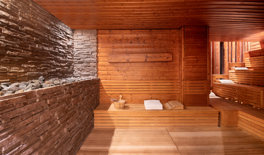Wooden sauna with towels and boiler in Tenerife.