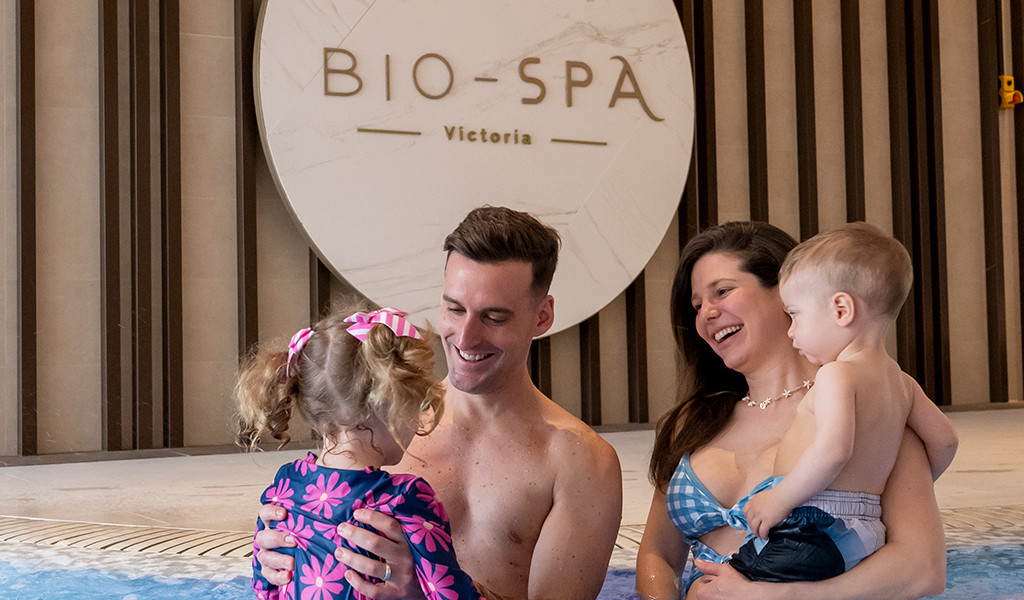 Family with small children in the swimming pool of the Bio-Spa Victoria in Tenerife.