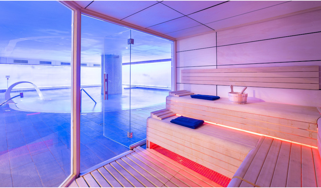Wooden sauna next to an indoor pool in a spa in Tenerife.