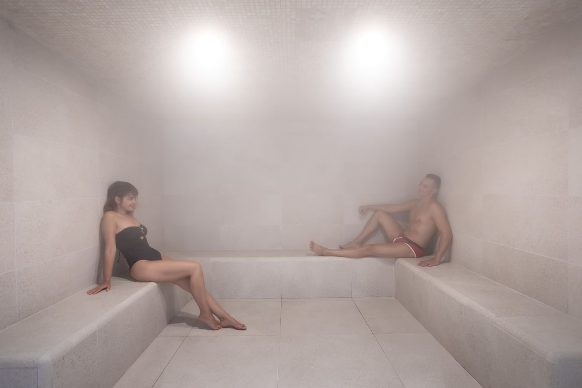 People relaxing in a steam sauna in Tenerife.