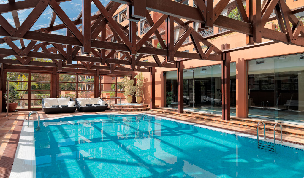 Indoor swimming pool with wooden ceilings in a hotel in Tenerife.