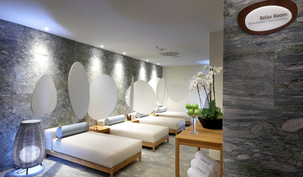 Spa relaxation room in Tenerife with stretchers and modern décor.