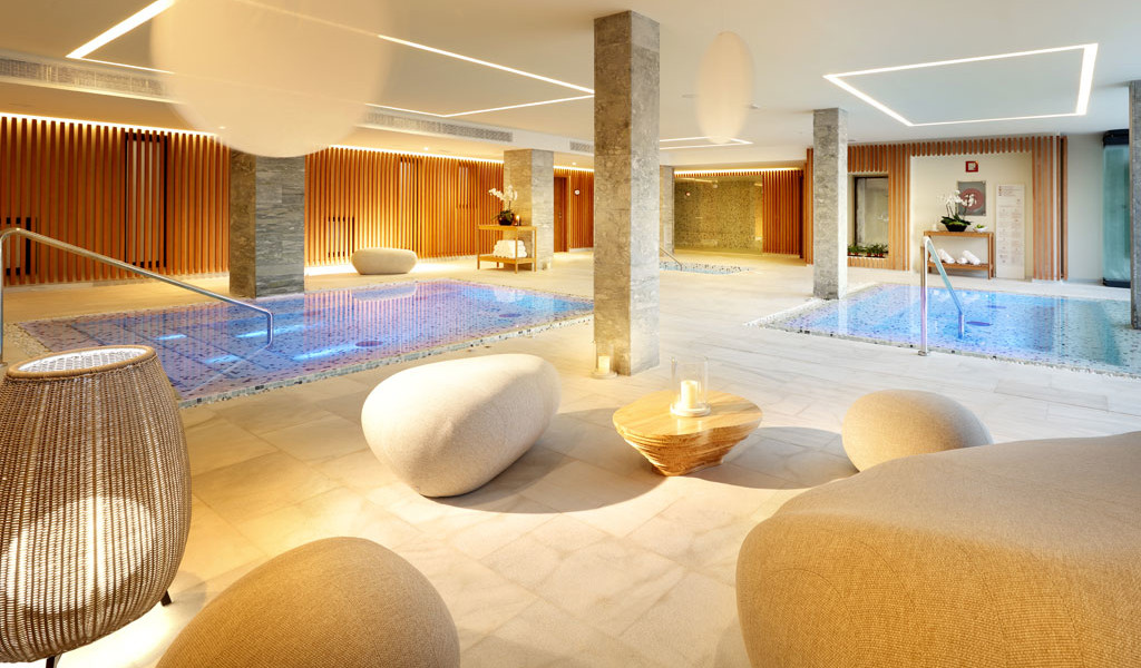 Indoor swimming pool and relaxation area in the spa of a hotel in Tenerife.