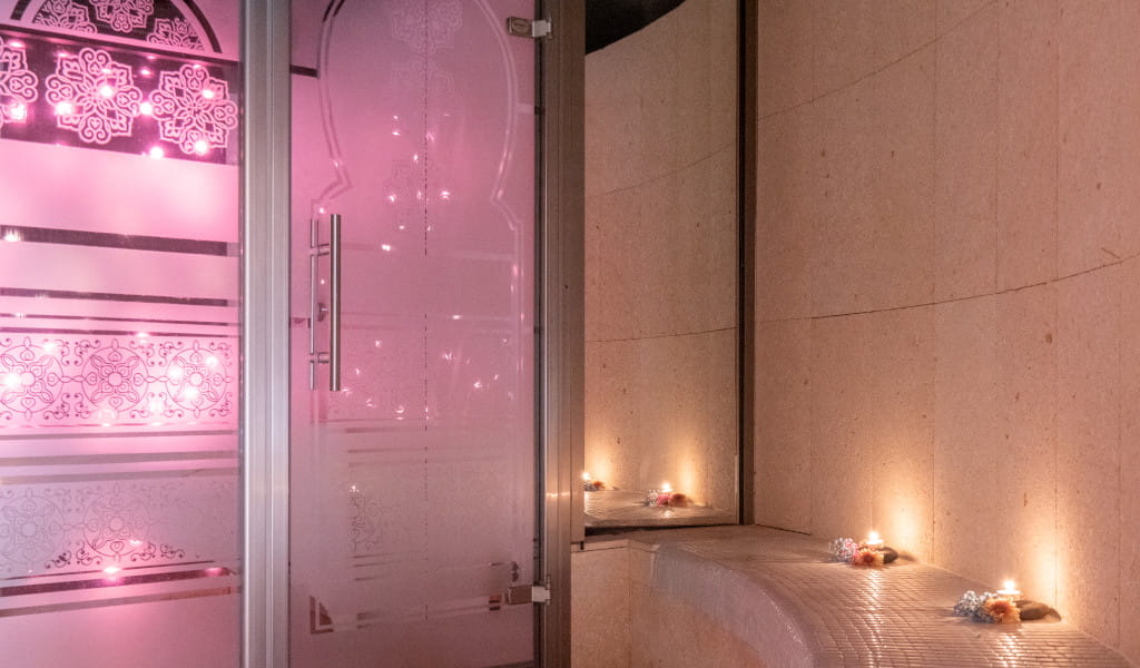 Decorative door illuminated with candles in spa in Tenerife.
