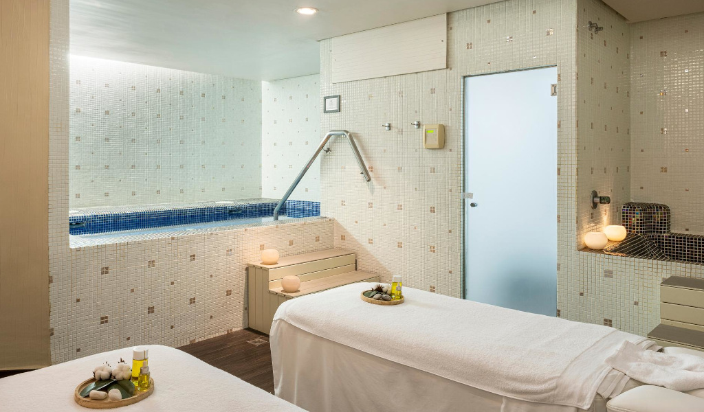 Spa treatment room with pool and stretchers in Tenerife.