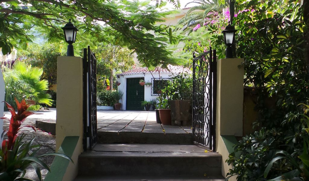 Entrance door to a garden with plants in a corner of Tenerife.