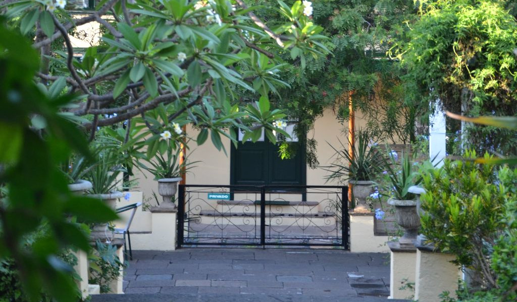 Garden with black door and private sign in Tenerife.