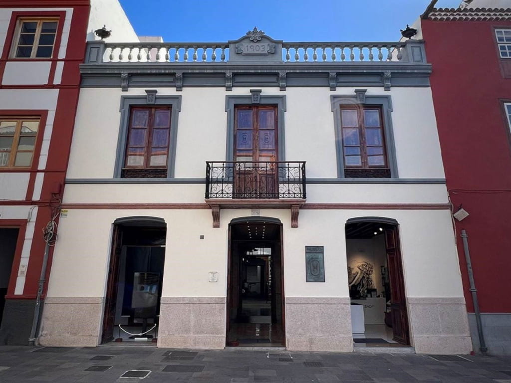 Historic building with balcony and year 1903 on the façade in Tenerife.