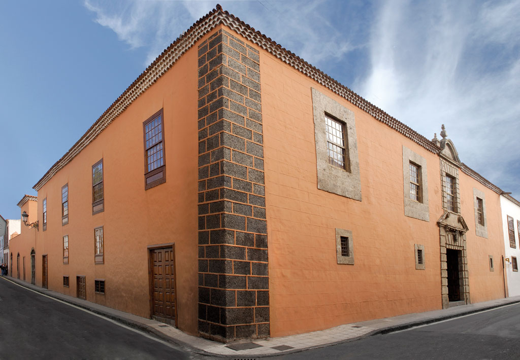 Historic building with orange façade on a street in La Laguna, Tenerife.