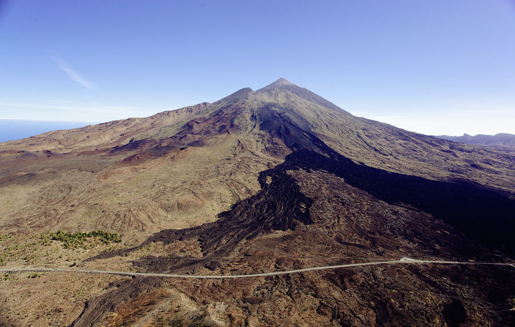 Mount Teide in Tenerife with clear skies and road in the foreground.