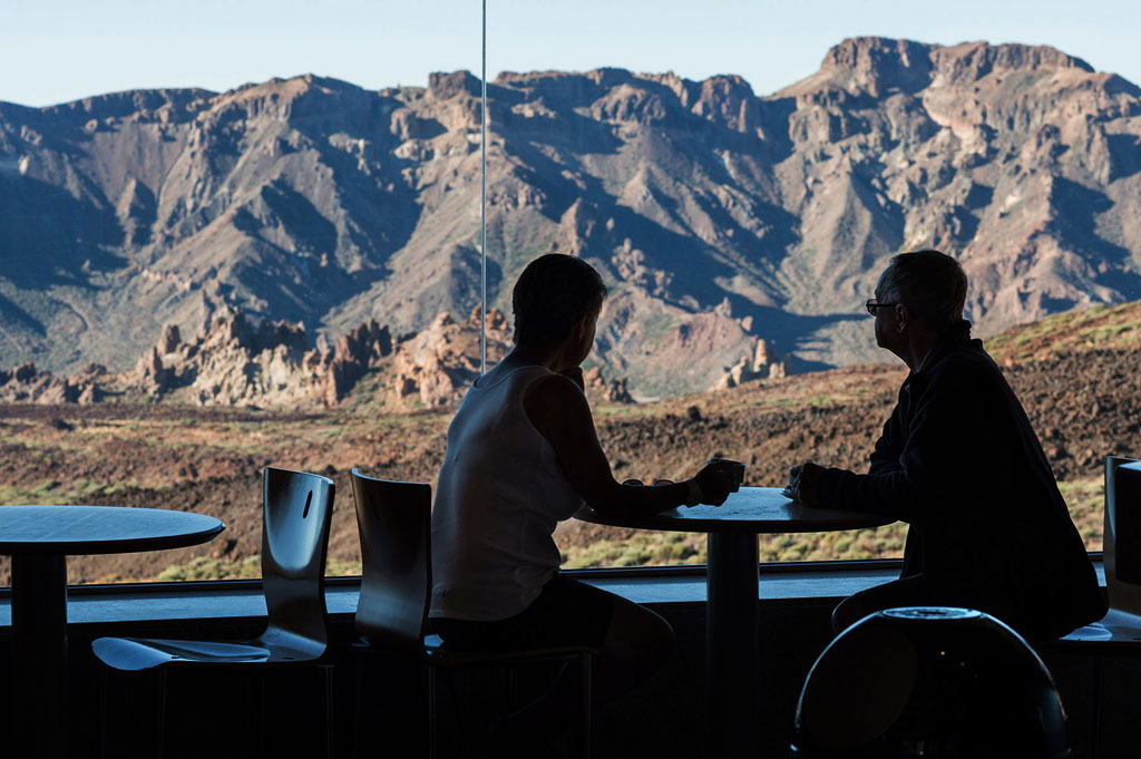 People chatting in front of the mountains in the Teide National Park, Tenerife.