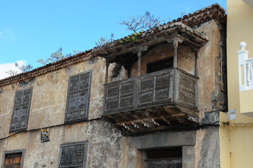 Old façade with wooden balcony in San Cristóbal de La Laguna, Tenerife.