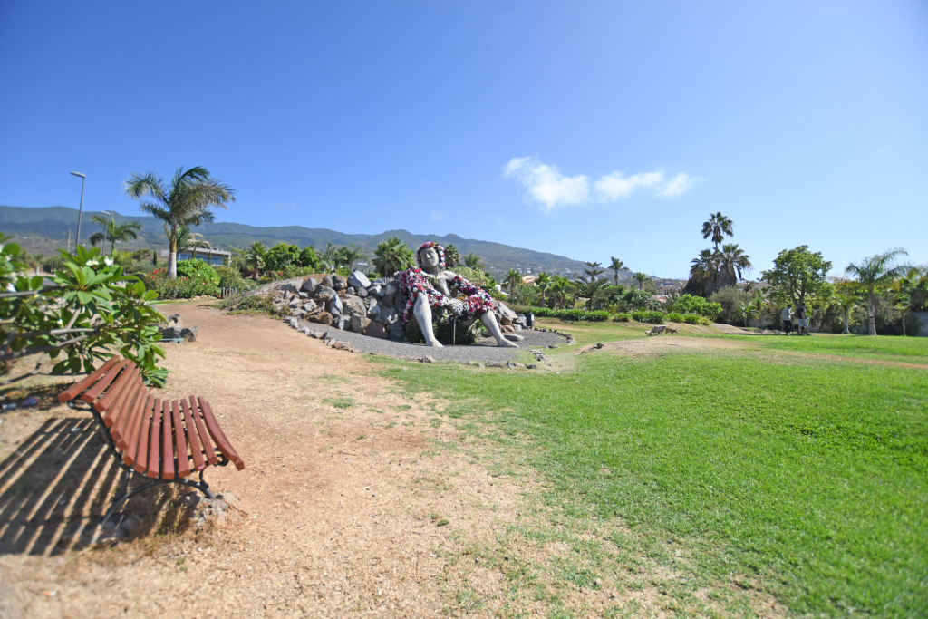 Bench and sculpture in park in Puerto de la Cruz, Tenerife.