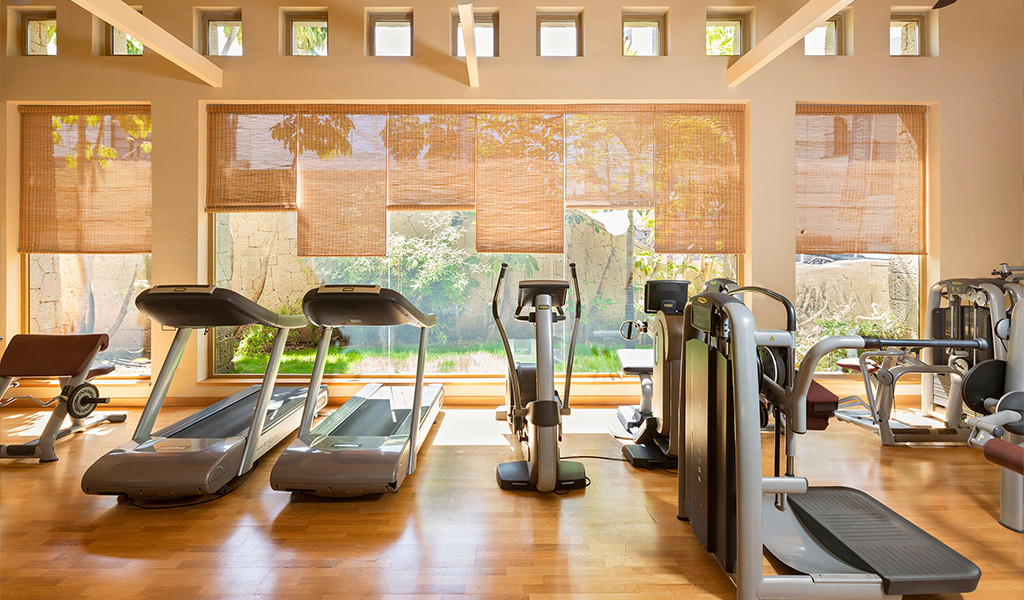 Modern gym with treadmills and exercise machines in Tenerife.