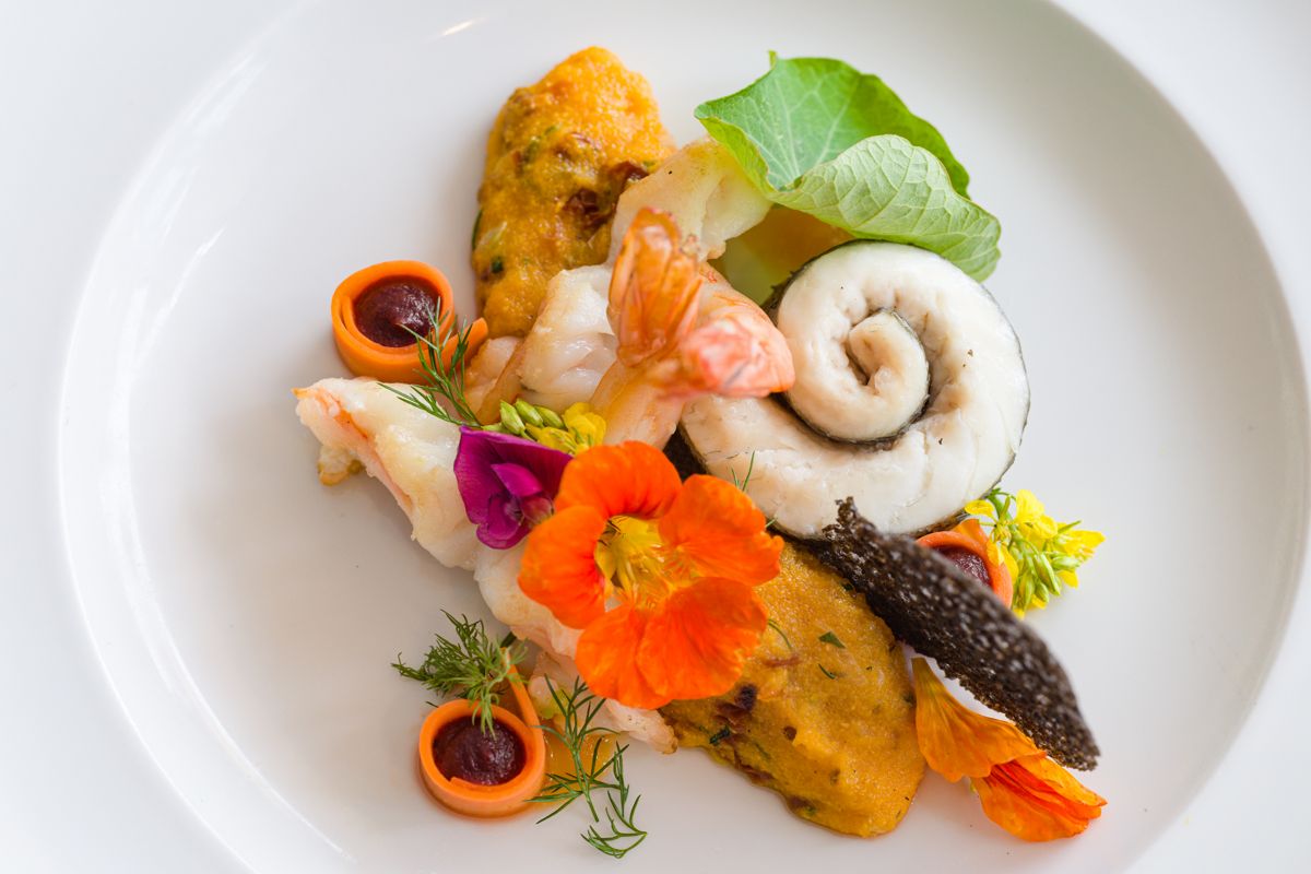 Gourmet dish with seafood, edible flowers and puree in Tenerife.