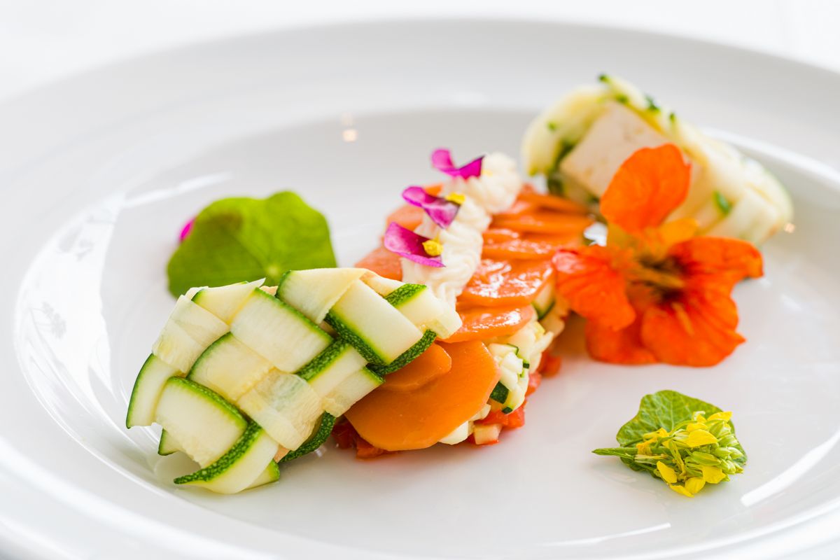 Gourmet dish with vegetables adorned with colorful flowers, Tenerife.