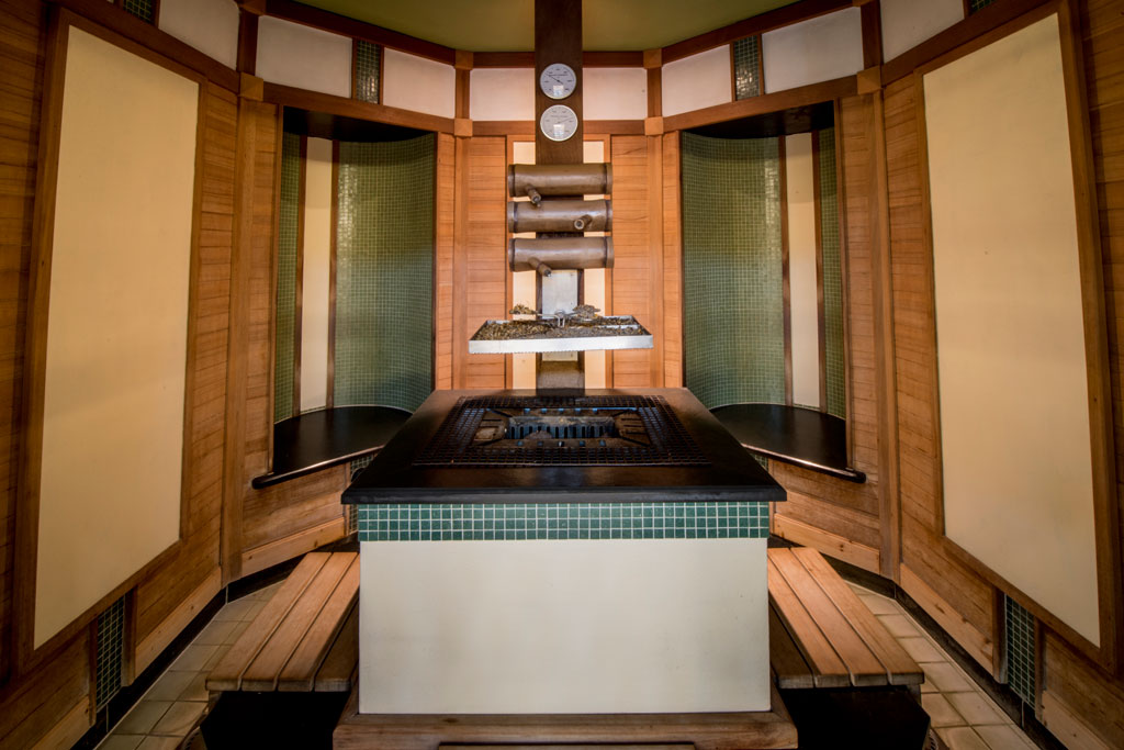 Traditional wooden sauna in Tenerife with thermometers on the wall.